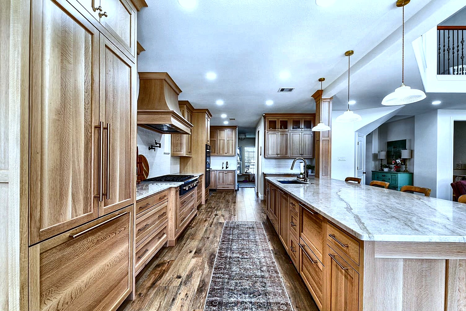 Custom wide light wood kitchen long island