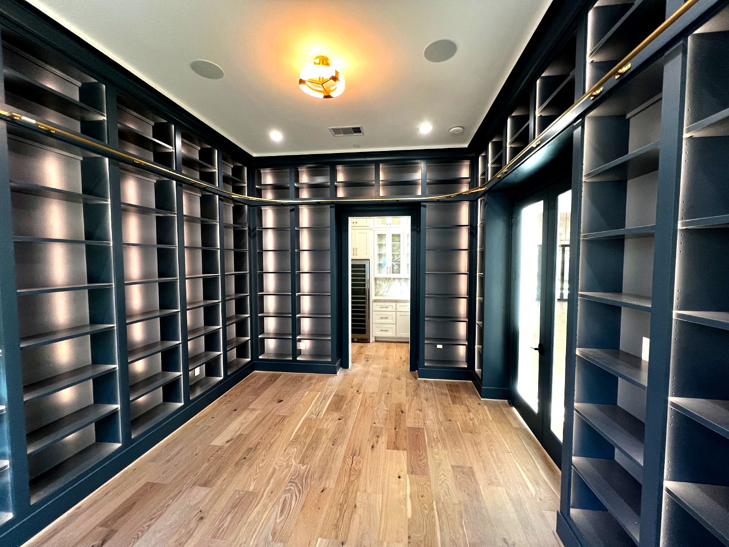 Floor-to-ceiling navy library wall