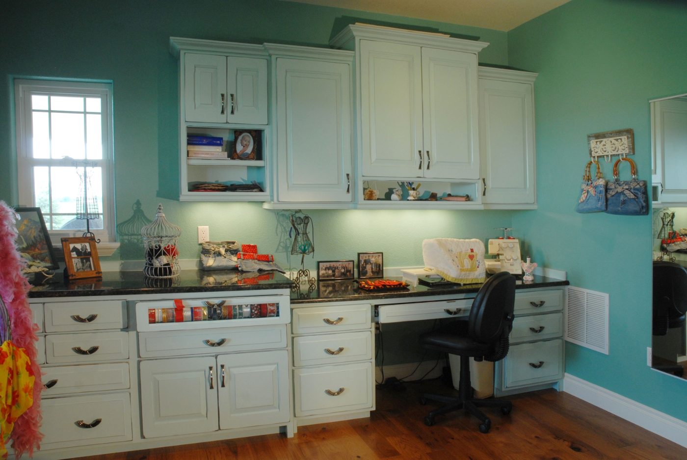 Built-in desk and cabinet wall with upper storage and open display shelving